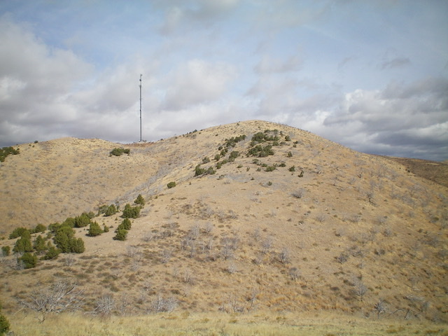 The upper section of the south ridge of Buck Peak. Notice the cell phone tower (left) and the gentle hump of Point 6373 (center). The summit is not yet visible. Livingston Douglas Photo