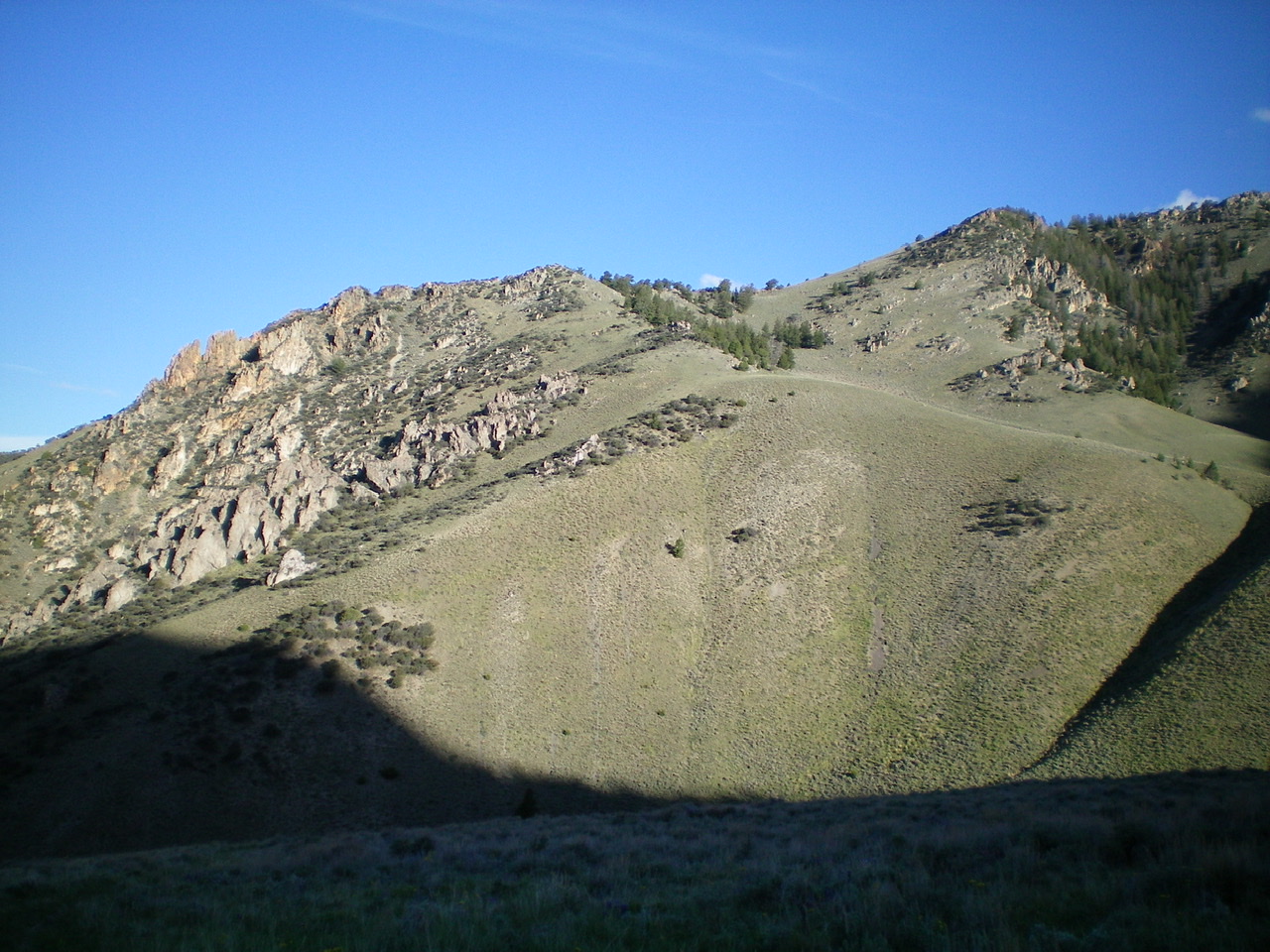 The lower 2/3 of the rocky, undulating South Ridge of Peak 8923 as viewed from the East. The skyline is the South Ridge. The summit is farther up and to the right and is not in the photo. Looks are deceiving. The South Ridge is actually not very rocky and has only one minor undulation. The ridge goes at Class 2. Livingston Douglas Photo