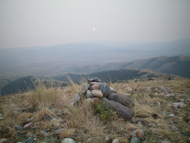 The summit cairn atop Paul Benchmark, looking east into the smoky haze. Livingston Douglas Photo