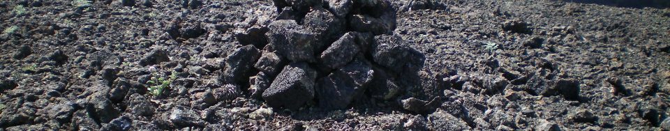 The summit cairn atop Broken Top with Big Cinder Butte in the background. Livingston Douglas Photo