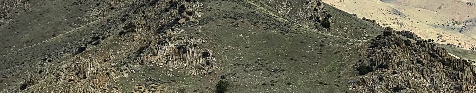 Peak 5580 viewed from Peak 5428. The highest point is behind the granite point.