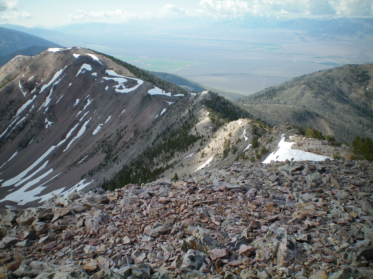 The South Ridge of Peak 10349 as viewed from the summit. Point 10077 is the bare hump left of center. Livingston Douglas Photo