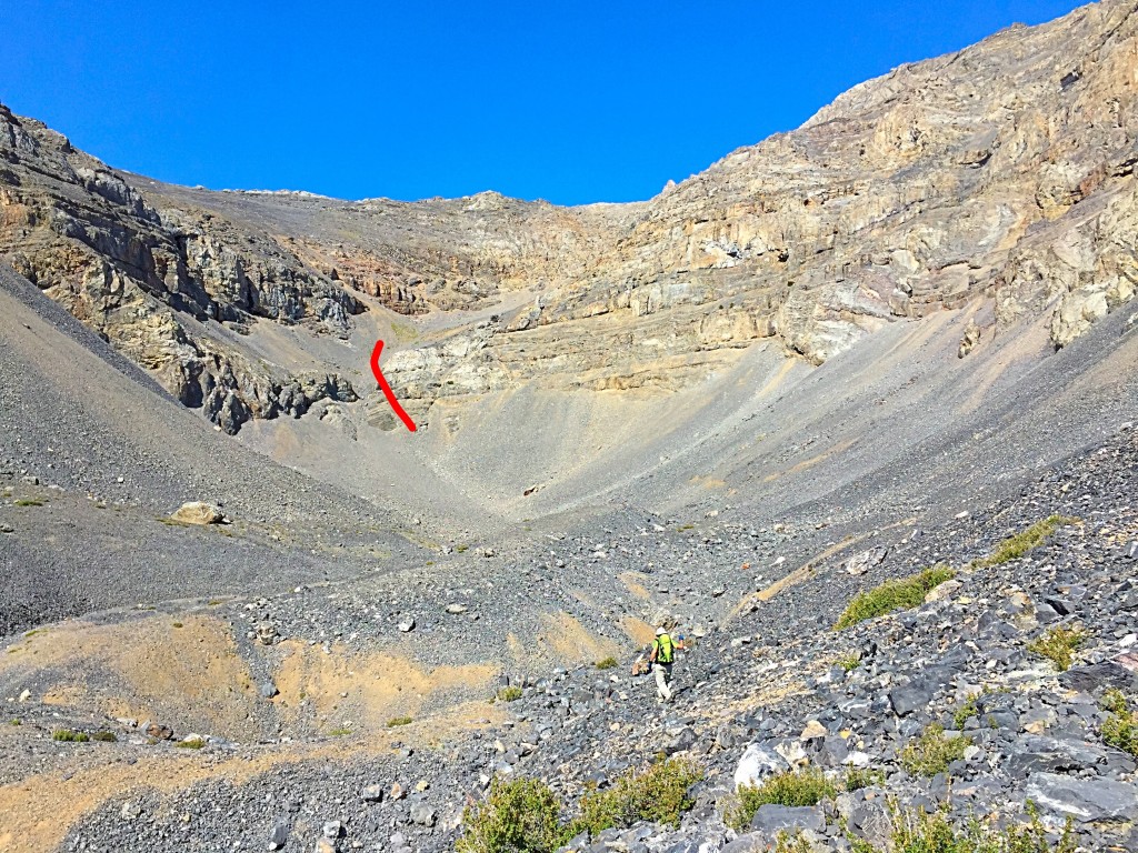 From treeline you enter a world of talus and broken cliffs. This photo shows the long slog to the upper basin.